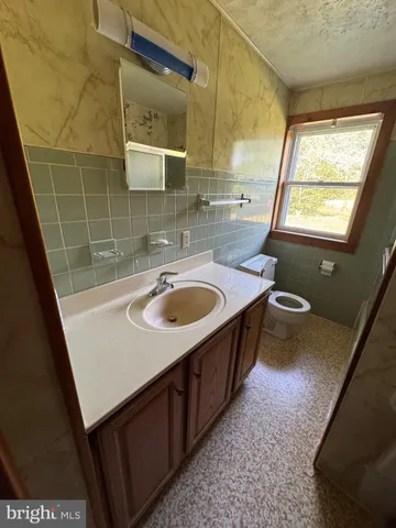 a bathroom with a sink a mirror and a bathtub
