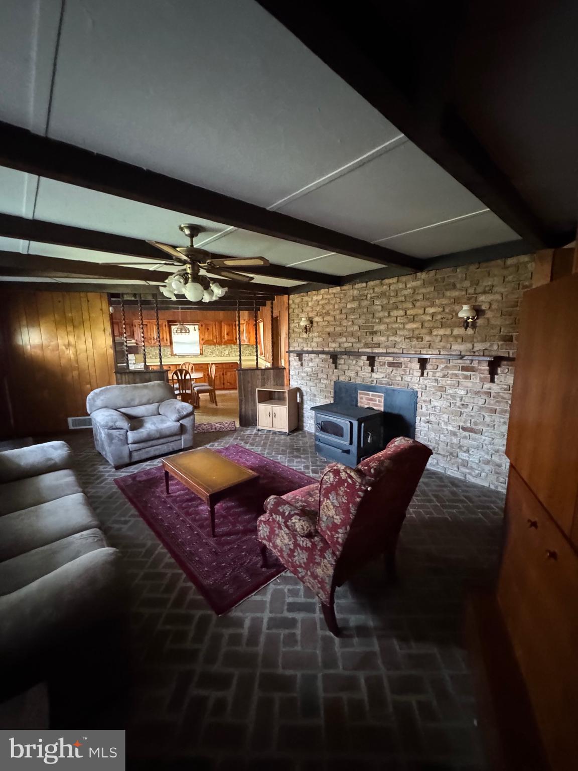 17990 Henderson Road Marydel, MD 21649 - Photo 10 of 24 a living room with furniture a patio and a fireplace
