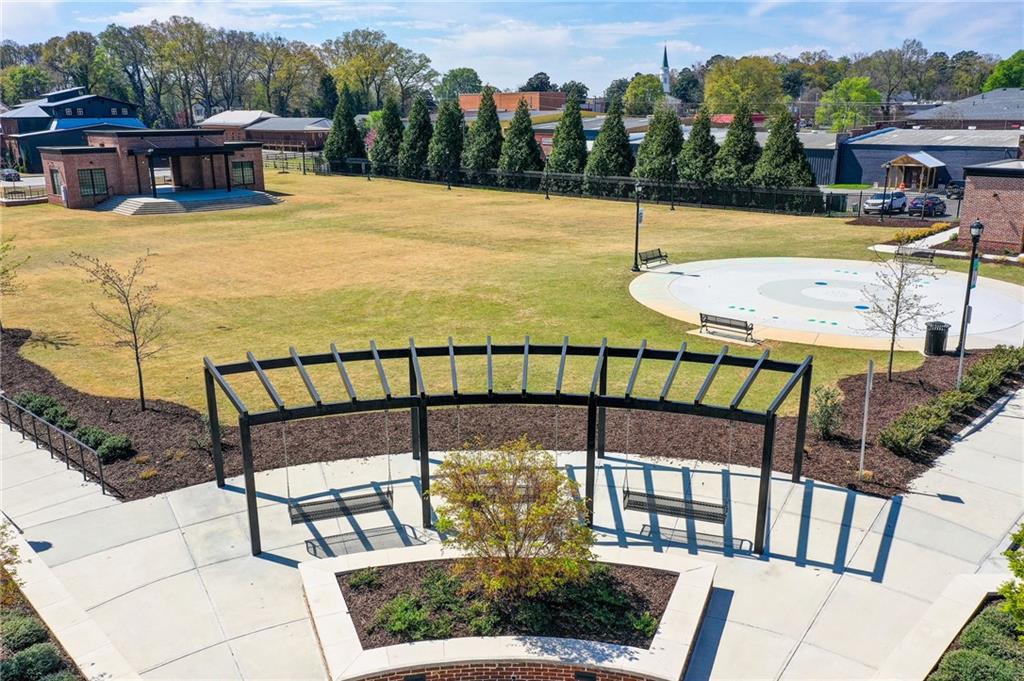 411 Ash Street Monroe, GA 30655 - Photo 31 of 36 a view of a swimming pool with a patio and mountain view