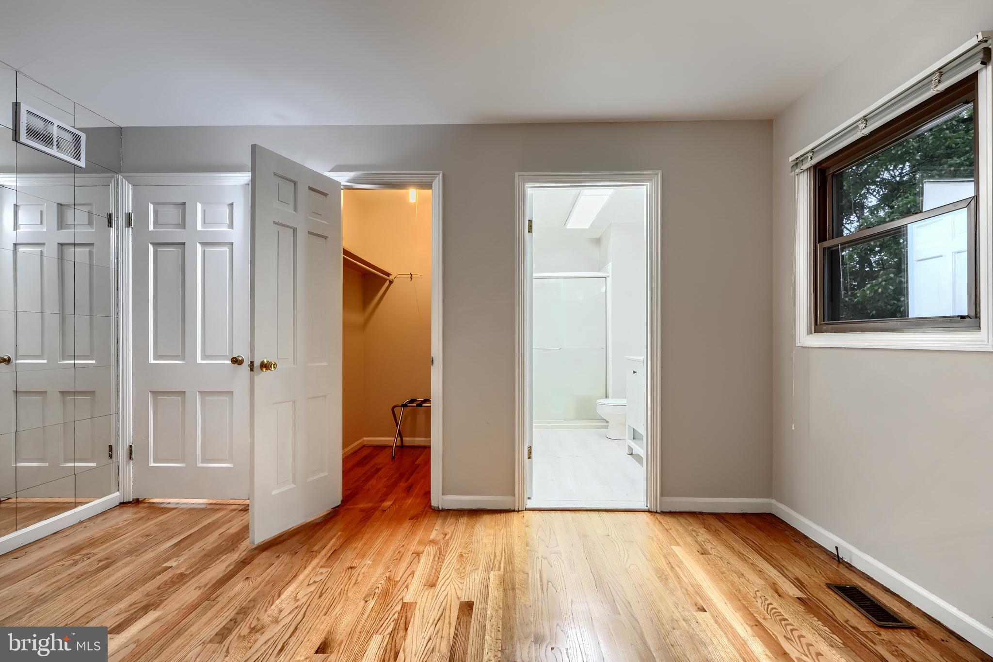 1012 Valewood Road Towson, MD 21286 - Photo 36 of 48 a view of an empty room with wooden floor and a window
