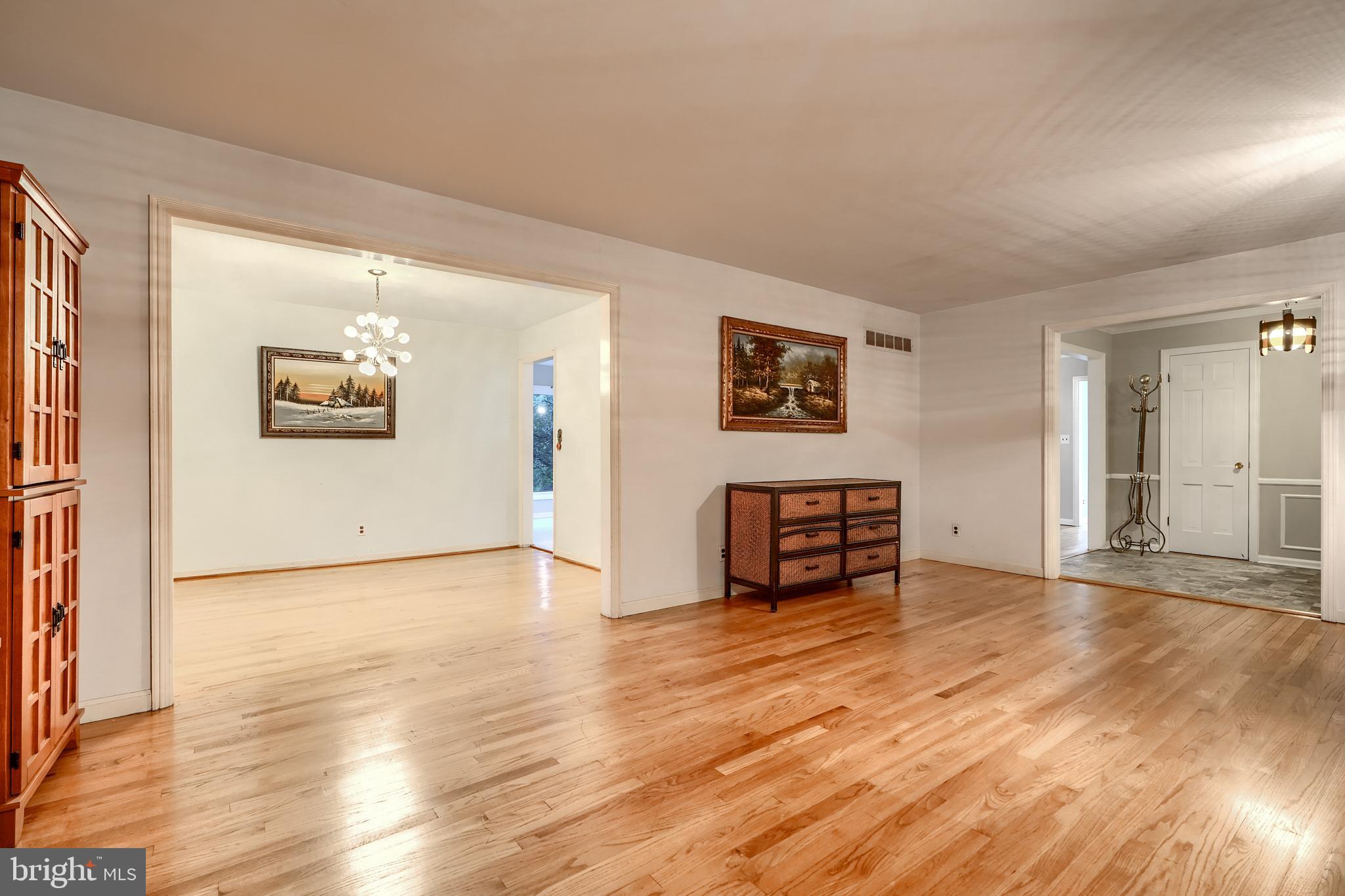 1012 Valewood Road Towson, MD 21286 - Photo 9 of 48 an empty room with wooden floor and windows