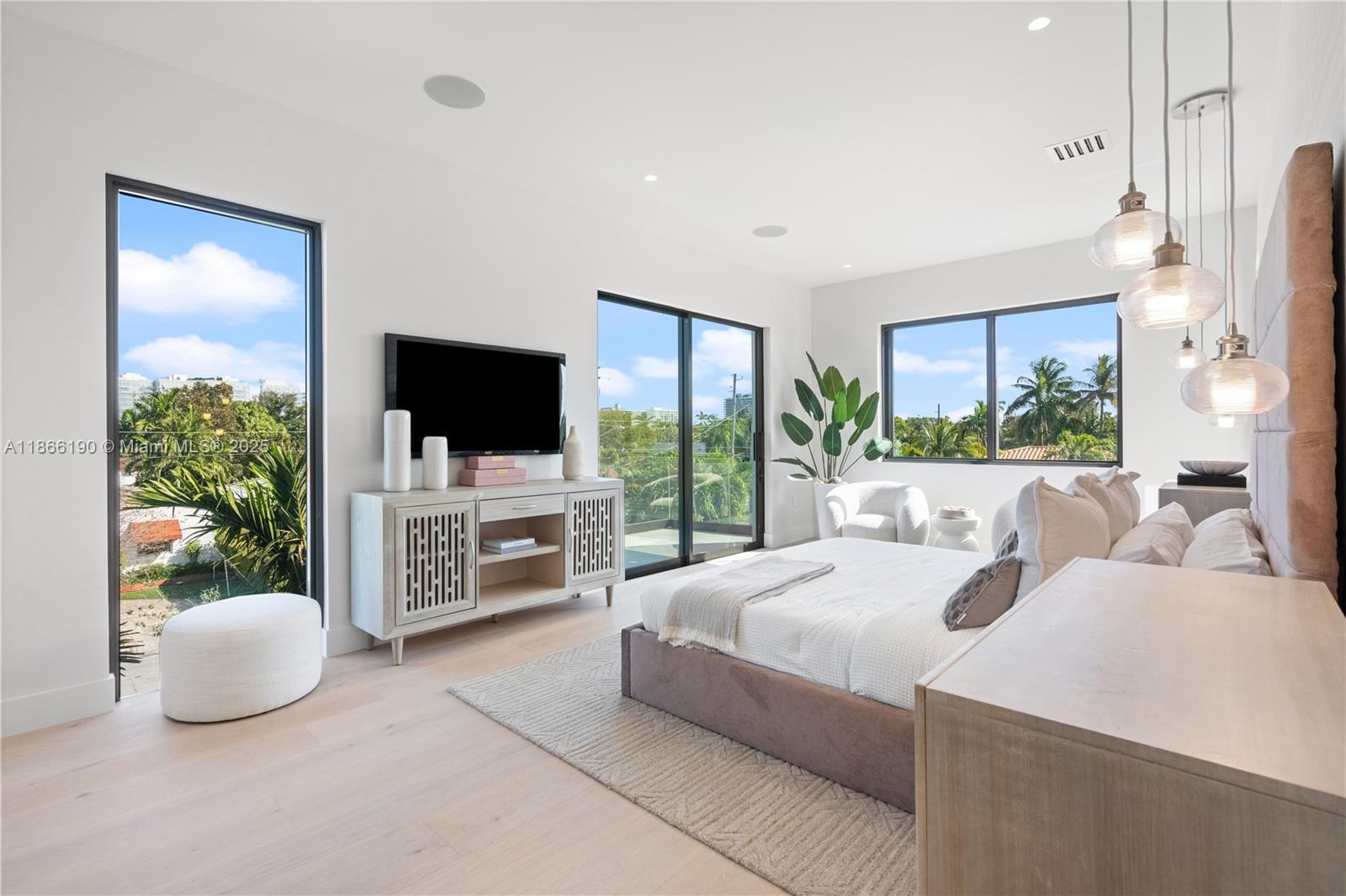 9132 Dickens Avenue Surfside, FL 33154 - Photo 15 of 37 a living room with furniture a flat screen tv and a large window