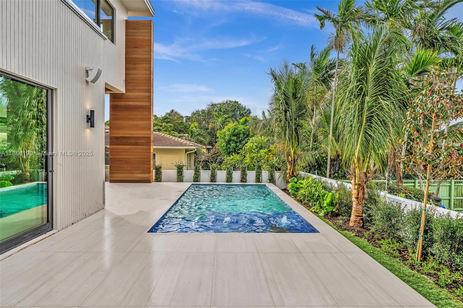 9132 Dickens Avenue Surfside, FL 33154 - Photo 36 of 37 a front view of a house with garden