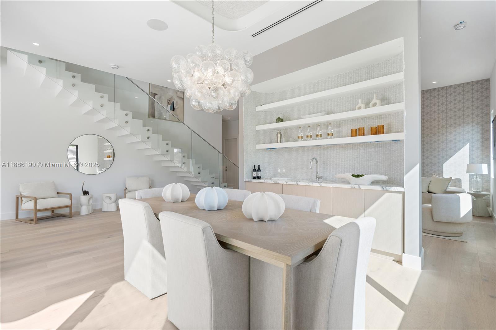 9132 Dickens Avenue Surfside, FL 33154 - Photo 9 of 37 a view of a dining room with furniture and chandelier