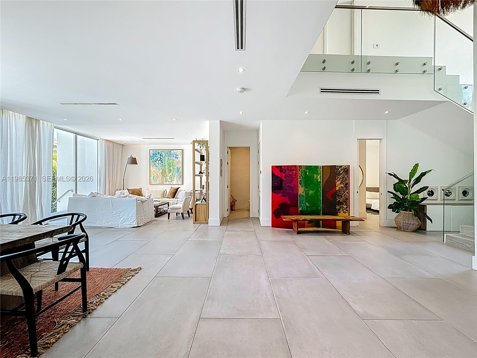 561 Warren Lane Key Biscayne, FL 33149 - Photo 11 of 30 a view of a livingroom with furniture and a flat screen tv