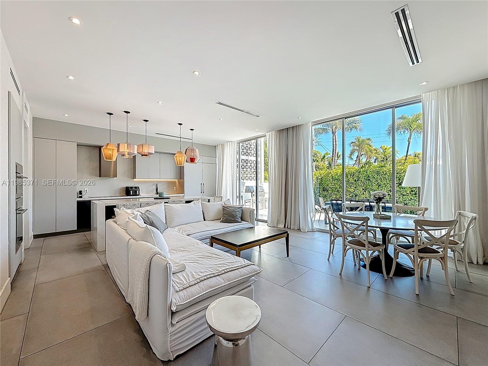 561 Warren Lane Key Biscayne, FL 33149 - Photo 13 of 30 a living room with furniture and a large window