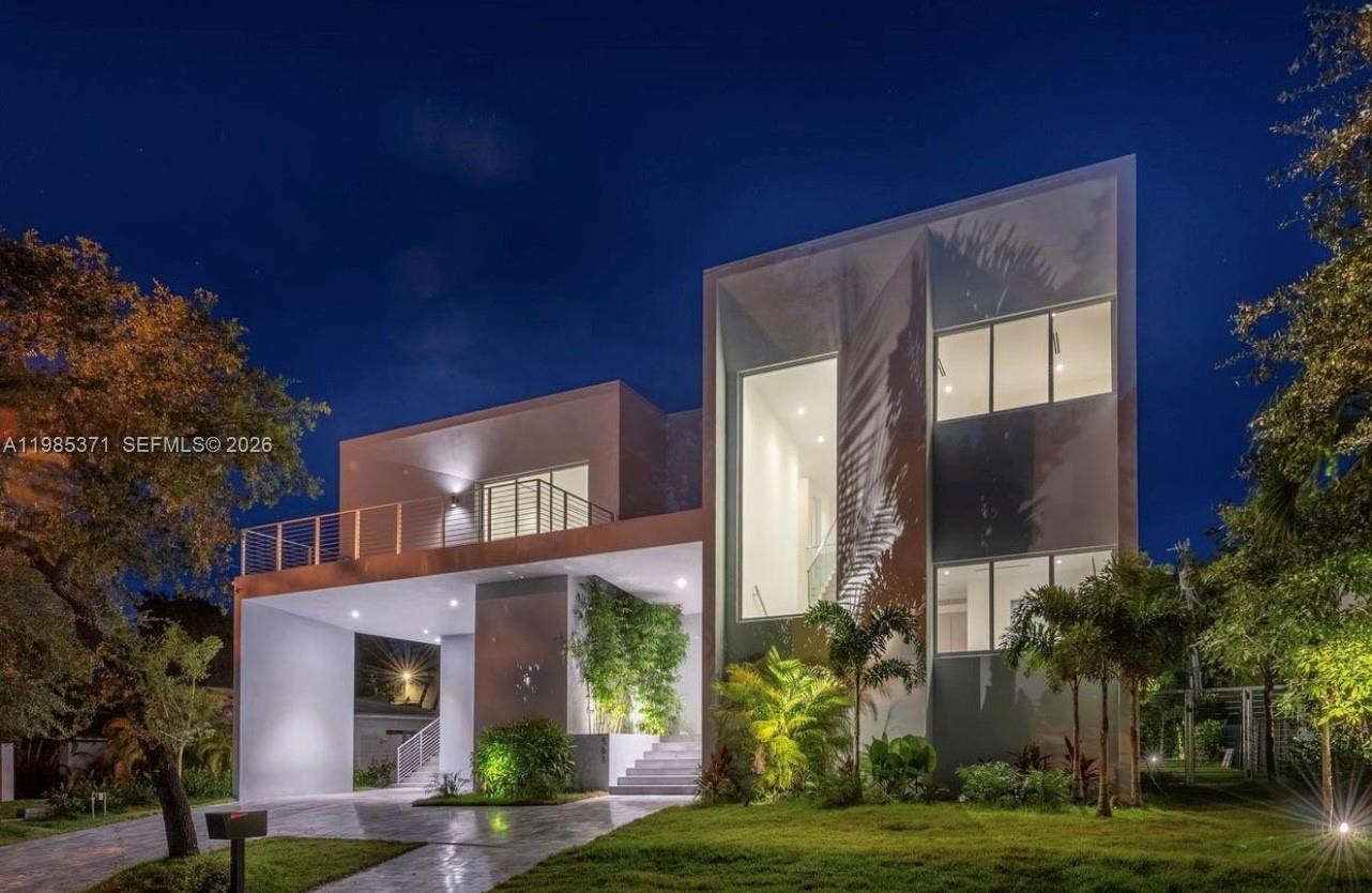 561 Warren Lane Key Biscayne, FL 33149 - Photo 16 of 30 a view of a building with a yard