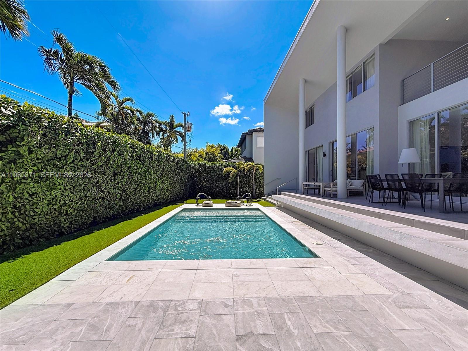 561 Warren Lane Key Biscayne, FL 33149 - Photo 17 of 30 a view of outdoor space yard and swimming pool