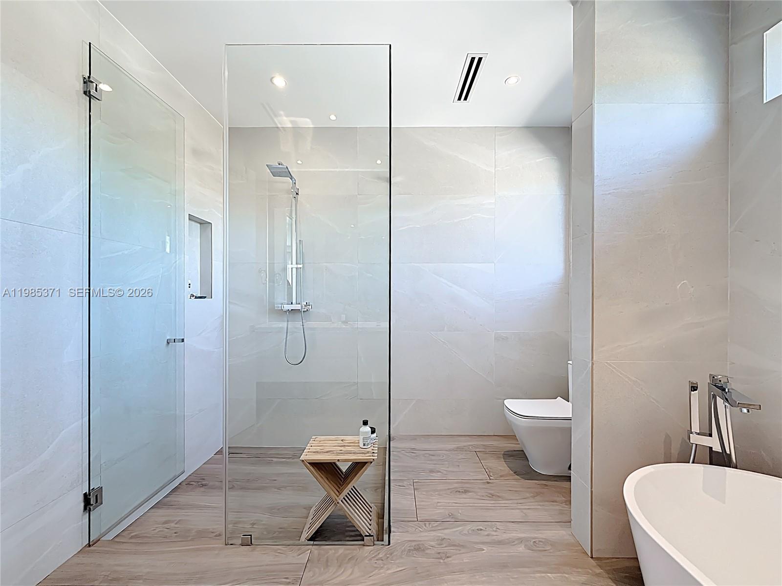 561 Warren Lane Key Biscayne, FL 33149 - Photo 20 of 30 a bathroom with a toilet a sink and shower