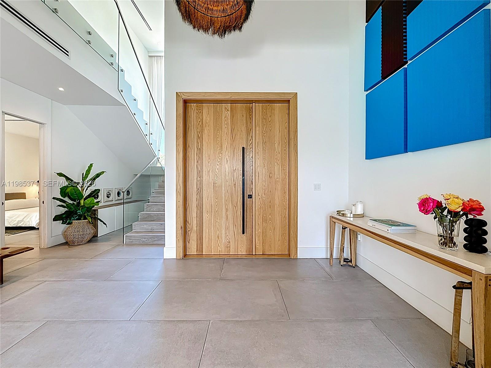 561 Warren Lane Key Biscayne, FL 33149 - Photo 2 of 30 a view of an entryway with a potted plant