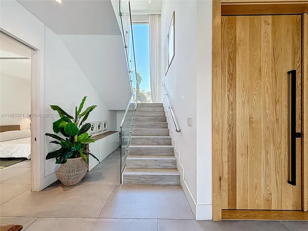a view of entryway with wooden door