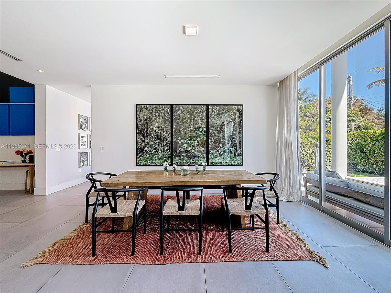 561 Warren Lane Key Biscayne, FL 33149 - Photo 9 of 30 a dining room with furniture and wooden floor
