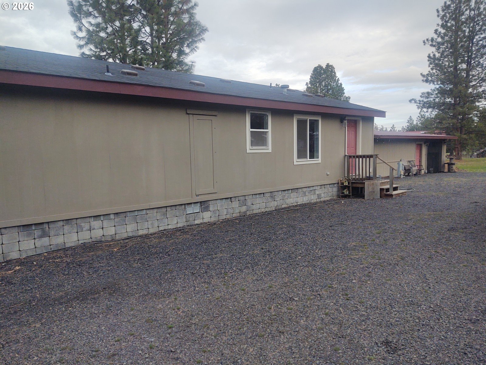 271 South Fairway Road, Unit B Tygh Valley, OR 97063 - Photo 14 of 31 a view of a house with a backyard and parking space