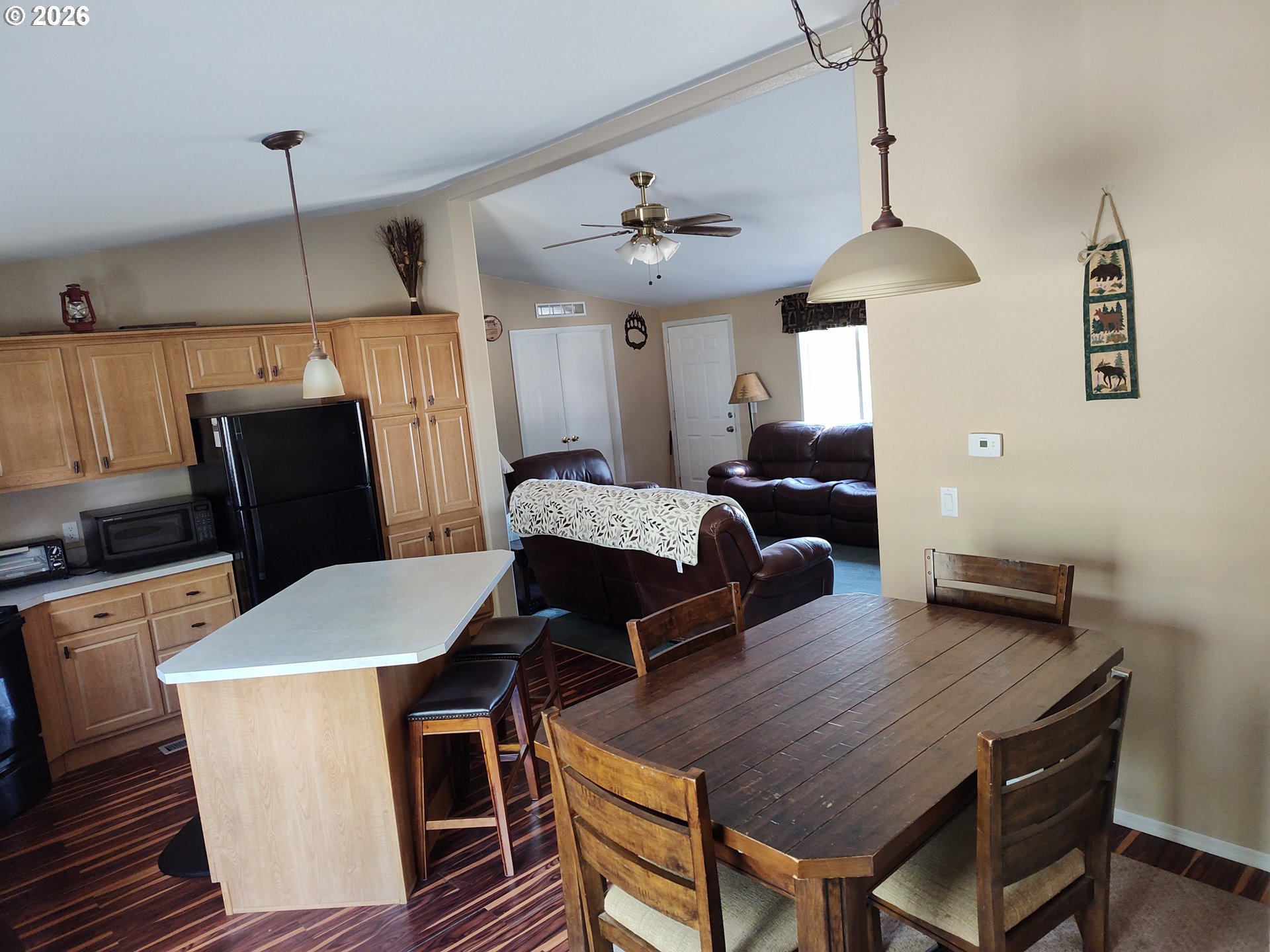 271 South Fairway Road, Unit B Tygh Valley, OR 97063 - Photo 4 of 31 a living room with furniture a dining table and a chandelier