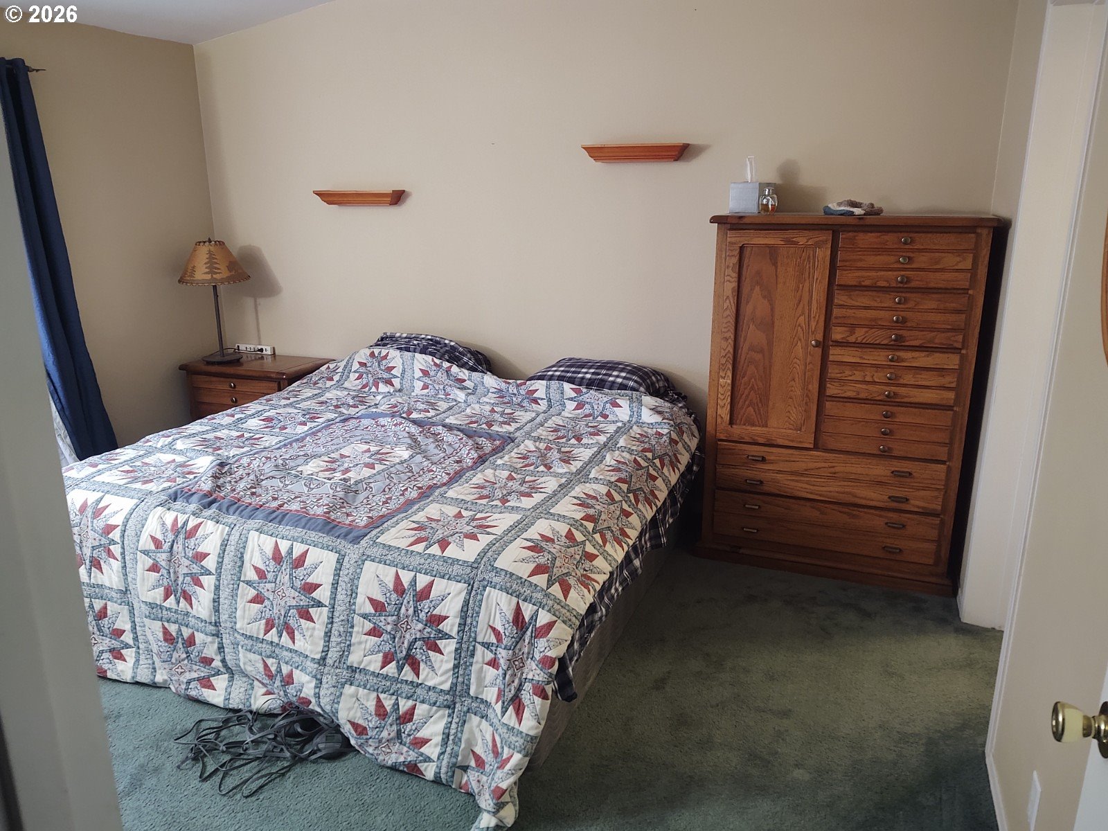 271 South Fairway Road, Unit B Tygh Valley, OR 97063 - Photo 7 of 31 a bed sitting in a bedroom next to a window