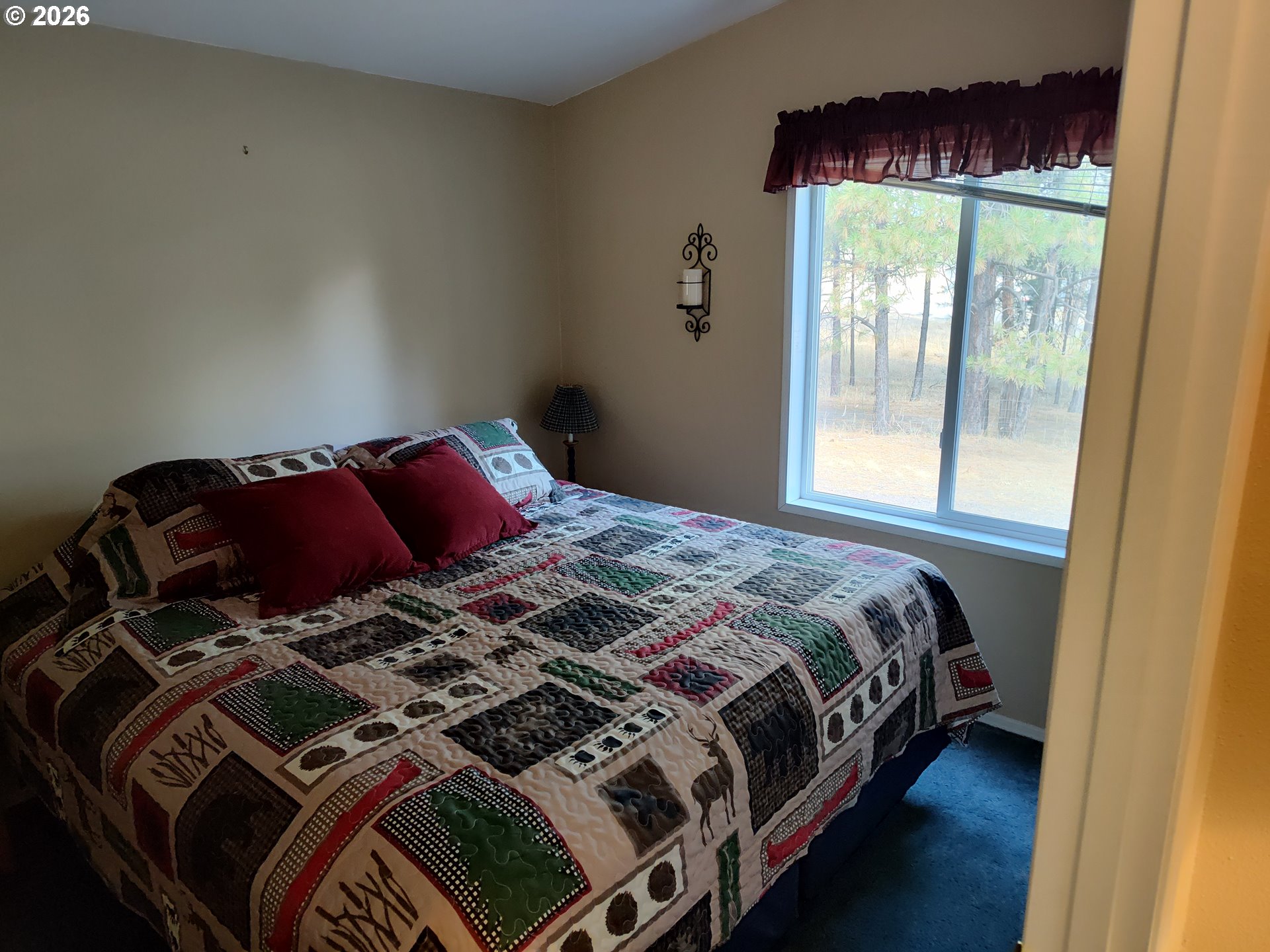 271 South Fairway Road, Unit B Tygh Valley, OR 97063 - Photo 8 of 31 a bedroom with a bed and a window