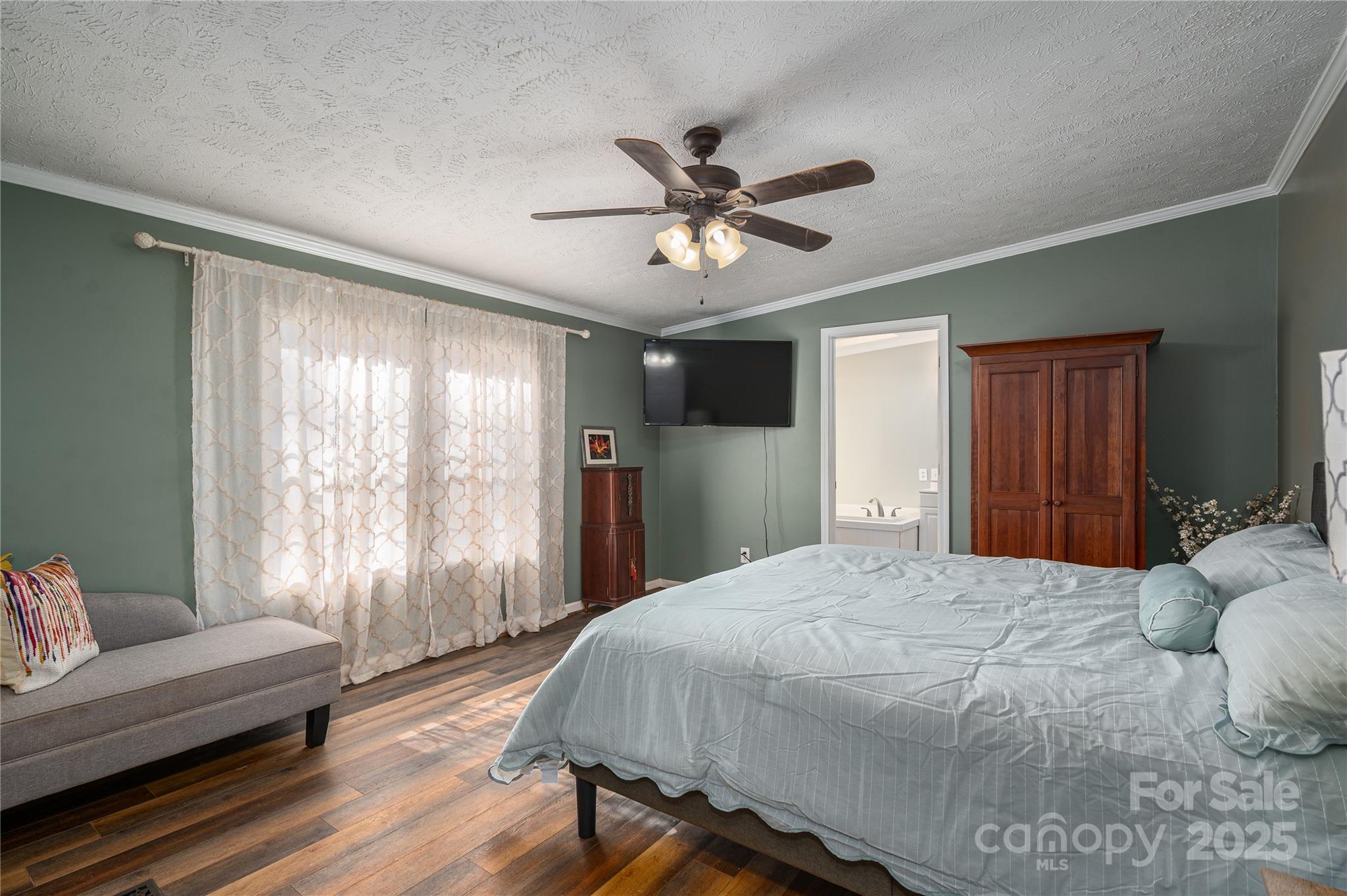 6636 Old Plank Road Stanley, NC 28164 - Photo 15 of 22 a bedroom with a bed and a couch