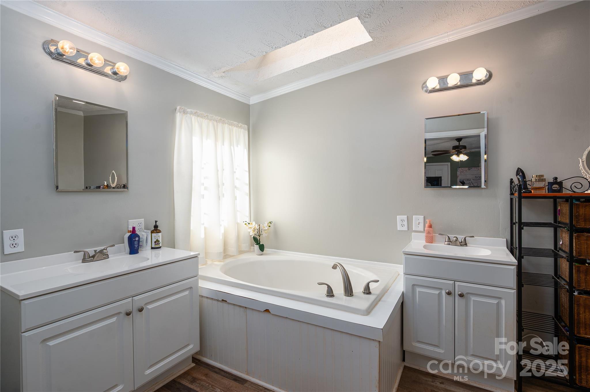 6636 Old Plank Road Stanley, NC 28164 - Photo 17 of 22 a bathroom with a sink and a mirror