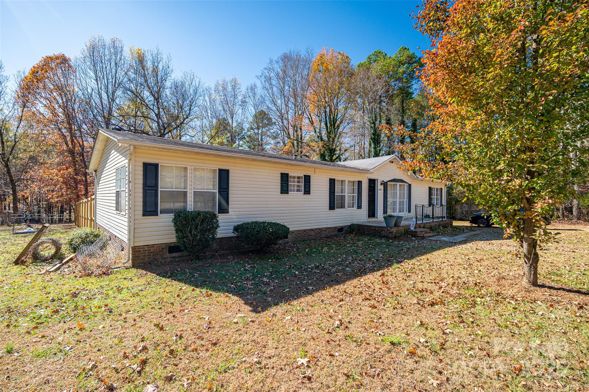 6636 Old Plank Road Stanley, NC 28164 - Photo 2 of 22 a view of a yard with a house and a tree