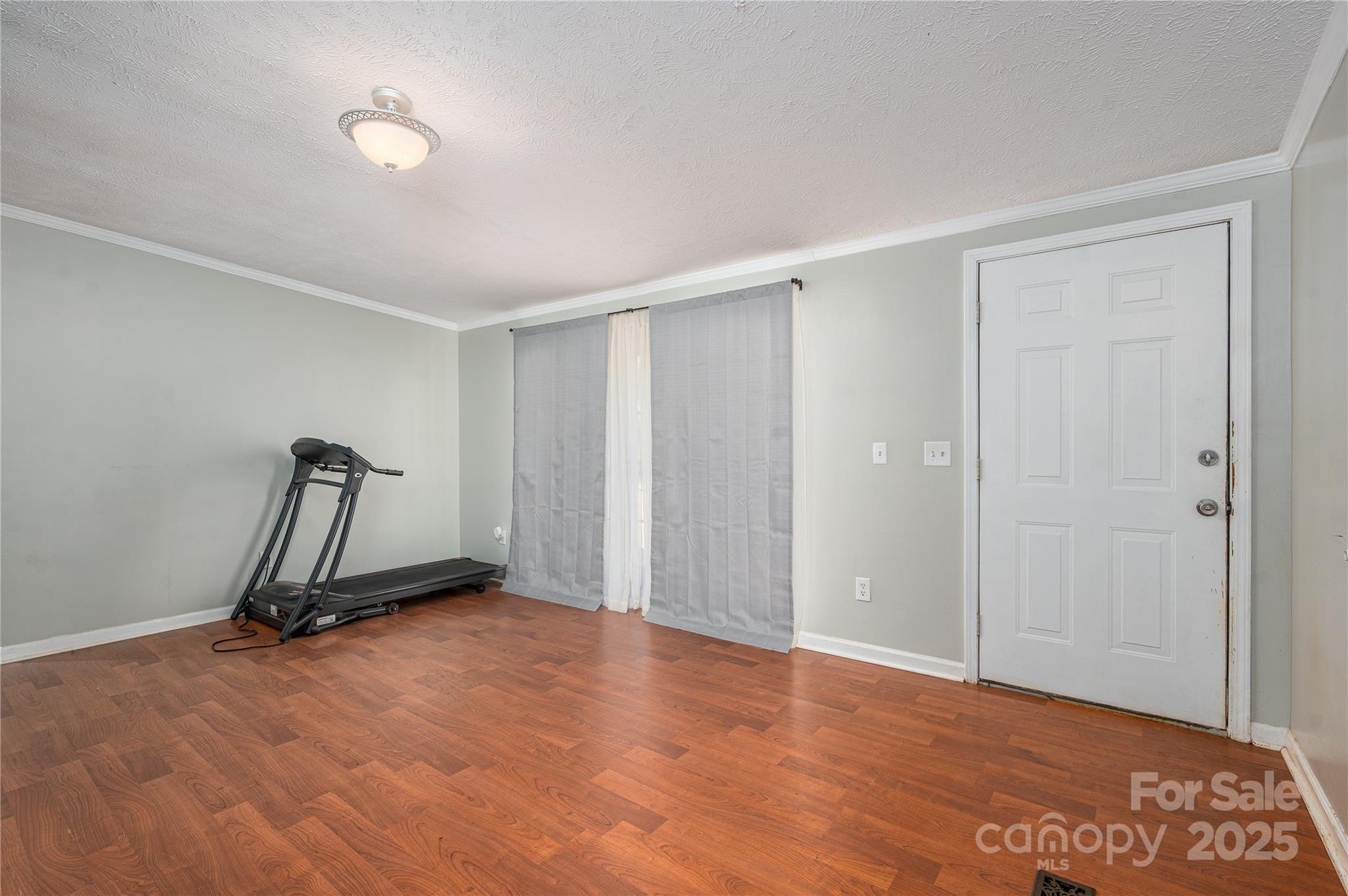 6636 Old Plank Road Stanley, NC 28164 - Photo 3 of 22 a view of a room with gym equipment