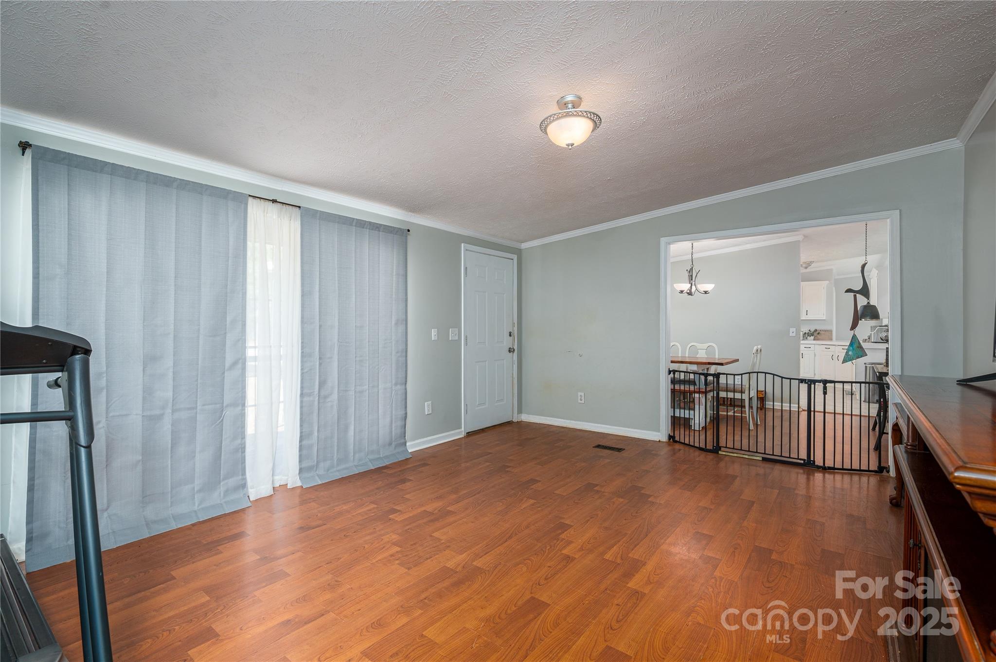 6636 Old Plank Road Stanley, NC 28164 - Photo 5 of 22 a view of a room with a furniture and a kitchen