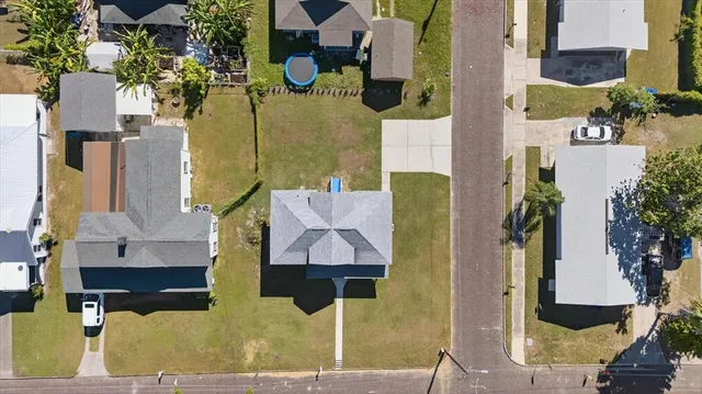 an aerial view of residential houses with outdoor space
