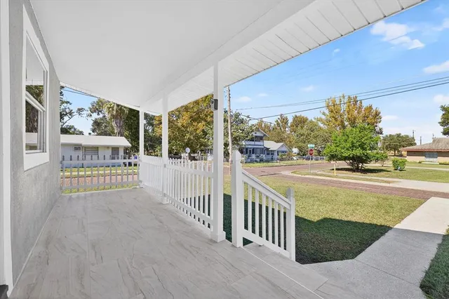 a view of balcony and yard