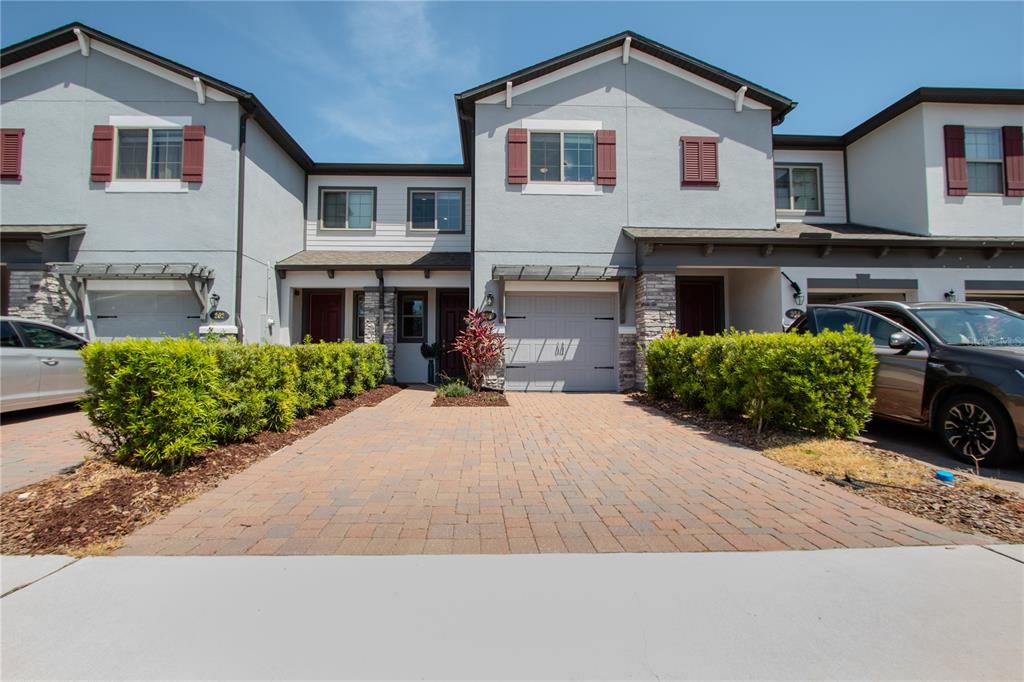 258 Rustic Loop Sanford, FL 32771 - Photo 1 of 1 a front view of a house with a yard and garage