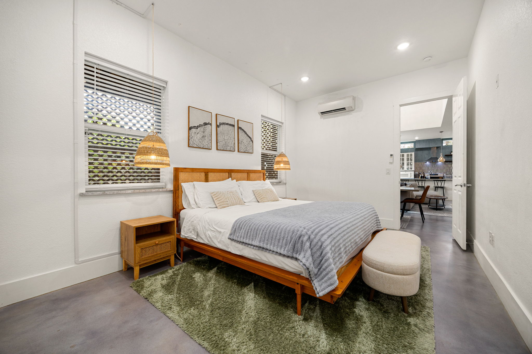 12808 Hughes Street Austin, TX 78732 - Photo 12 of 40 a bedroom with a bed and a table