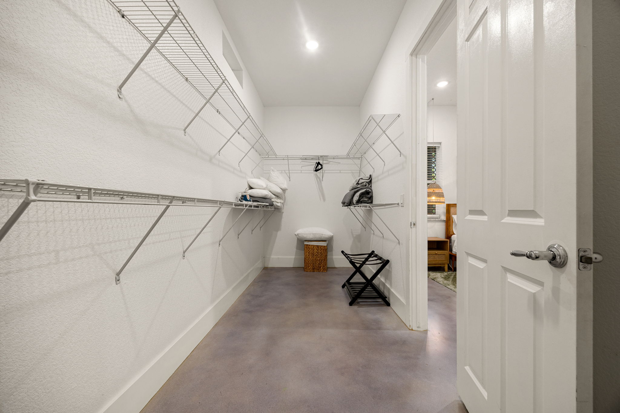 12808 Hughes Street Austin, TX 78732 - Photo 14 of 40 a view of a room with a wooden floor and a window