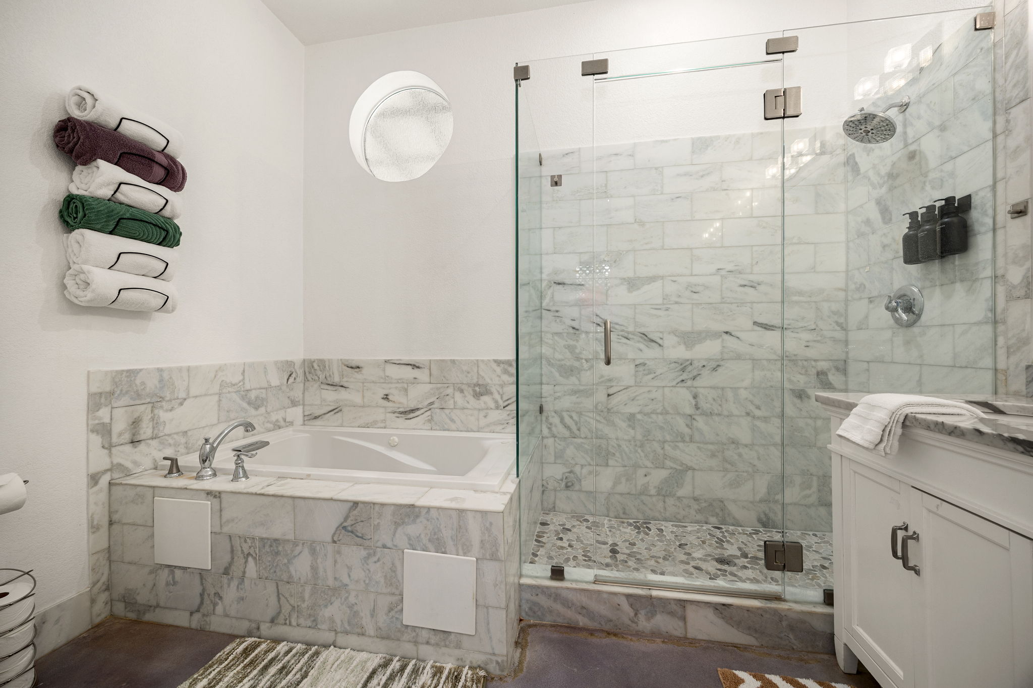 12808 Hughes Street Austin, TX 78732 - Photo 16 of 40 a bathroom with a tub a sink and a shower