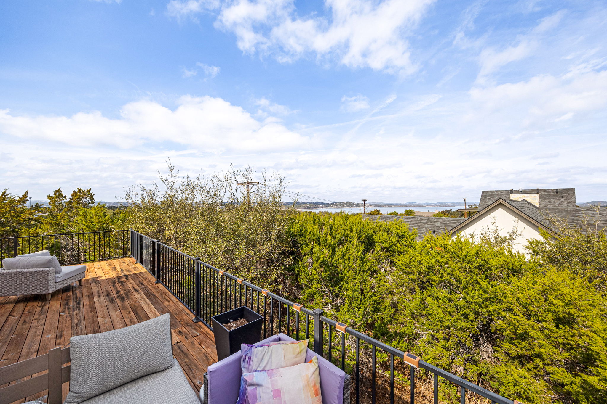 12808 Hughes Street Austin, TX 78732 - Photo 25 of 40 a view of a balcony with ocean view