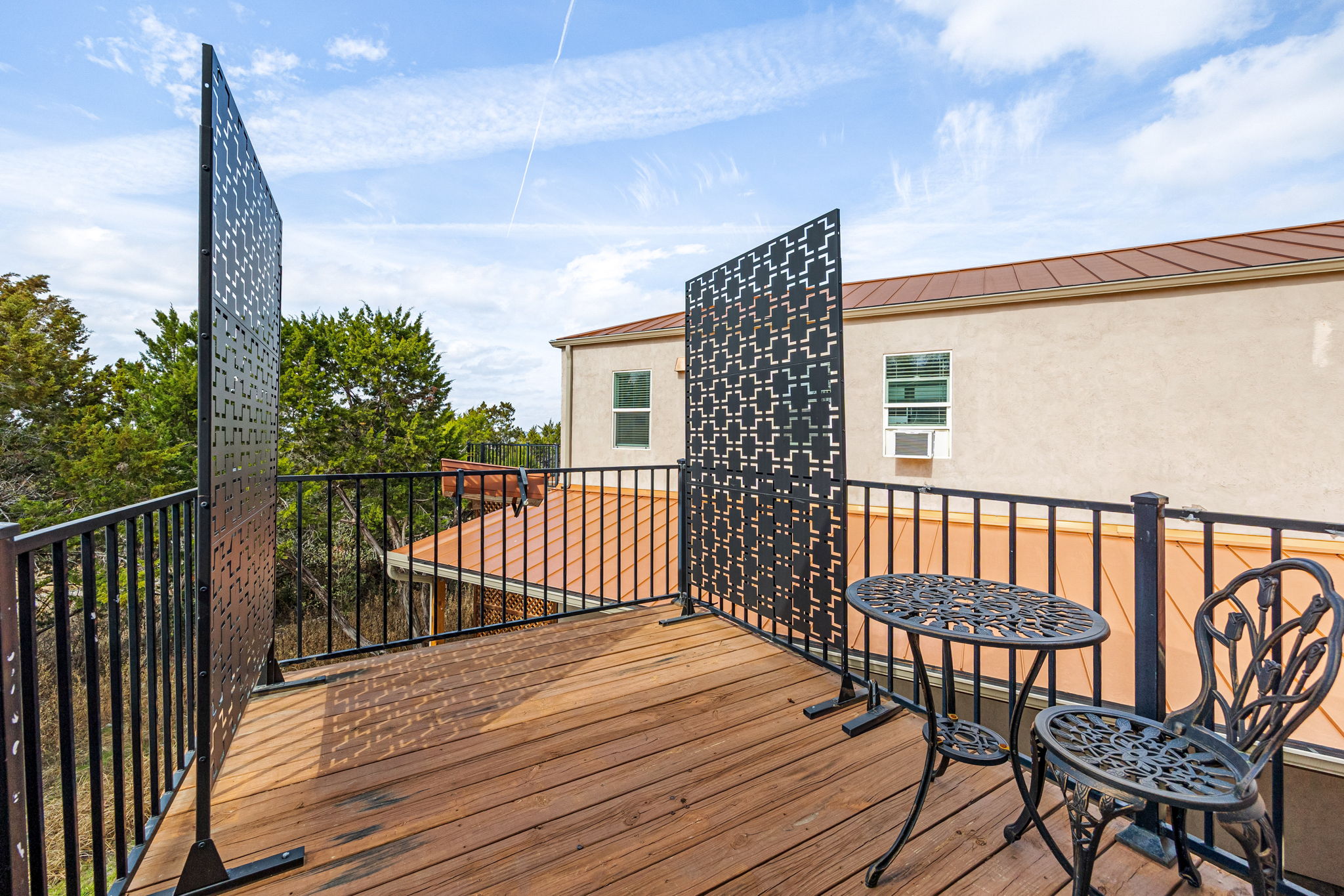 12808 Hughes Street Austin, TX 78732 - Photo 26 of 40 a balcony with wooden floor and fence