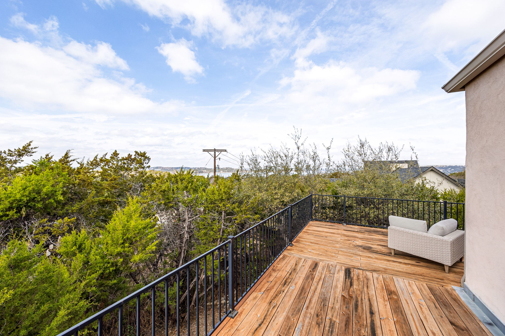 12808 Hughes Street Austin, TX 78732 - Photo 27 of 40 a view of a balcony with wooden floor