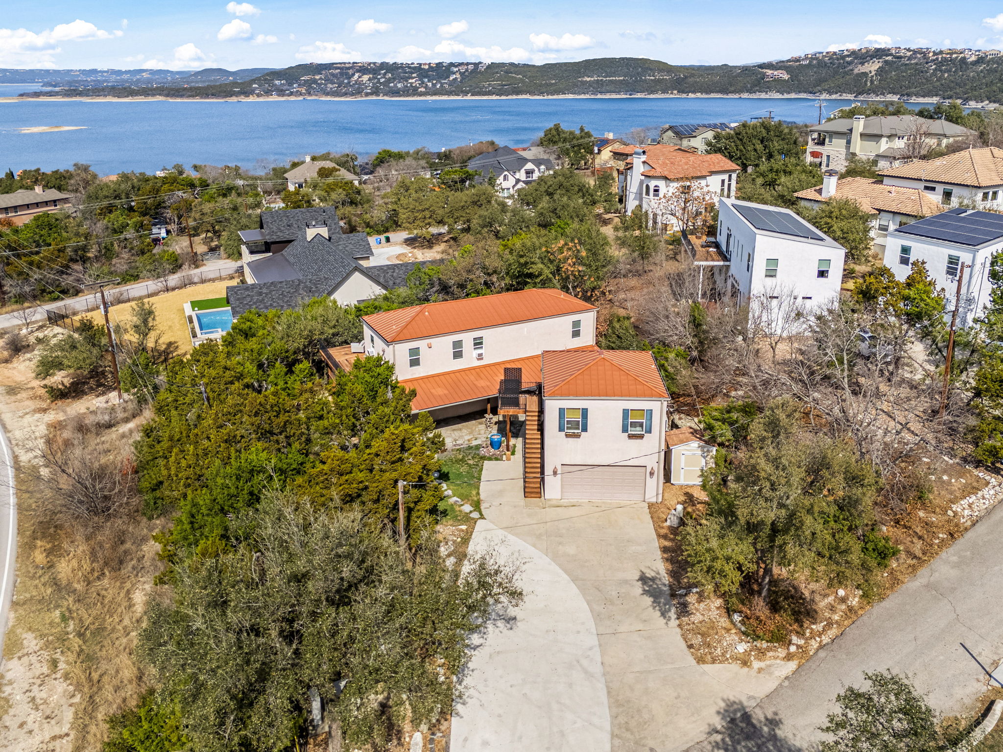 12808 Hughes Street Austin, TX 78732 - Photo 30 of 40 an aerial view of a house with a lake view
