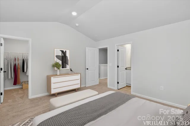 a view of hallway with stairs and wooden floor