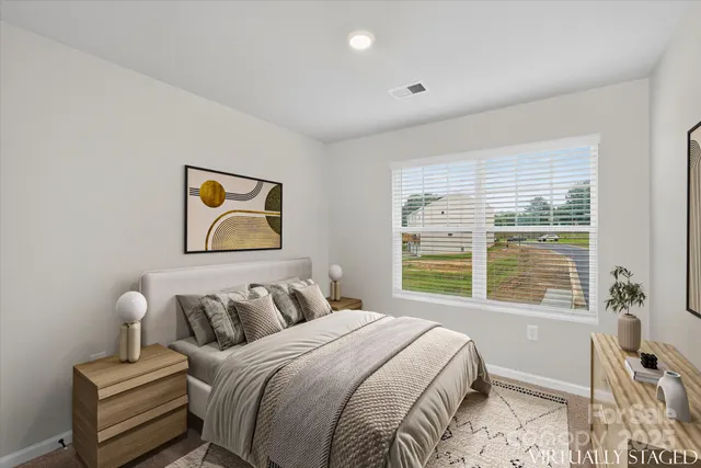 a view of a house with wooden deck
