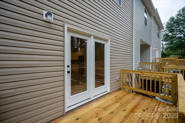 a view of a balcony with wooden floor