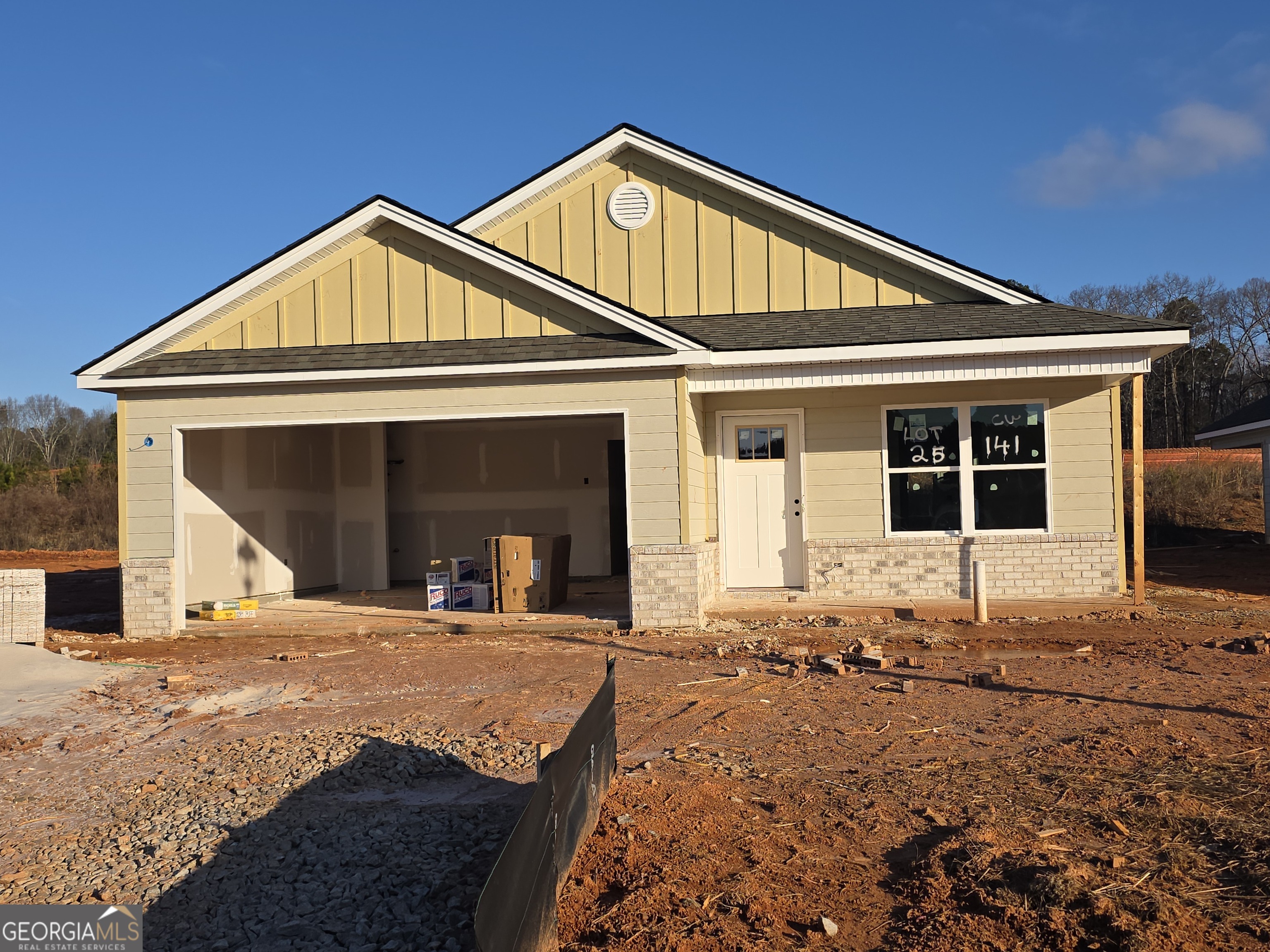 141 Charlie Way, Unit 25 Winder, GA 30680 - Photo 1 of 1 a front view of a house with a yard