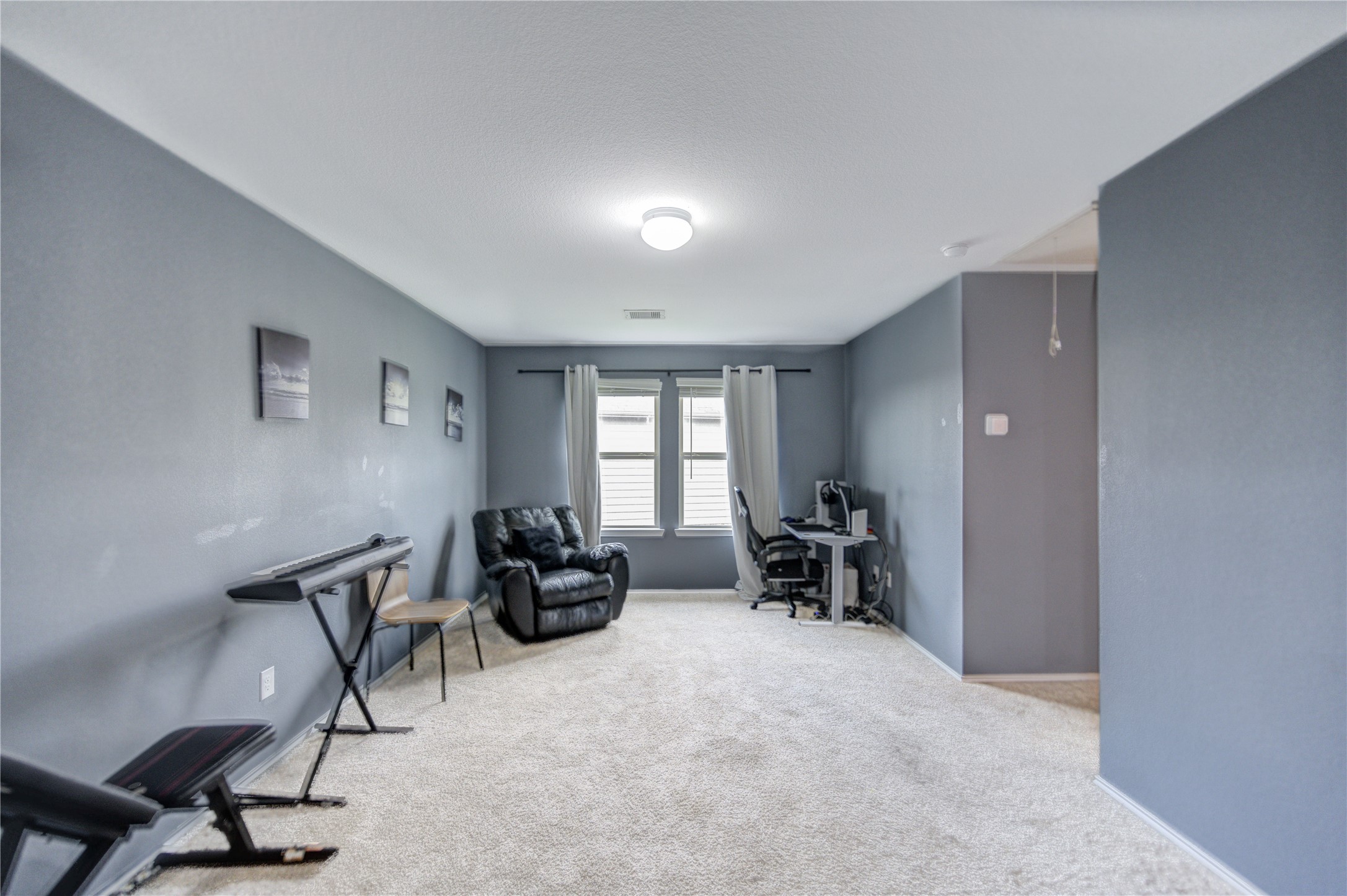 2306 Rainier Mist Road Spring, TX 77373 - Photo 26 of 28 Spacious game room, ideal for a home office, entertainment, or music space.