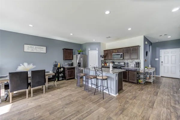 a view of a dining room with furniture