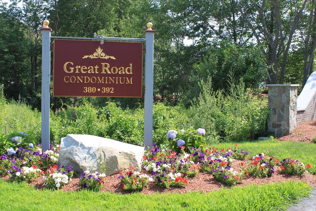 a sign on the side of the tree