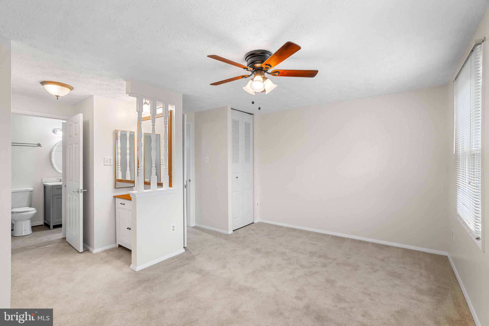8408 Cedar Falls Court Springfield, VA 22153 - Photo 20 of 36 a view of a livingroom with a chandelier fan and a window