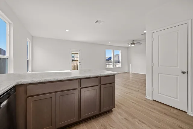 a spacious bathroom with double vanity and a mirrors