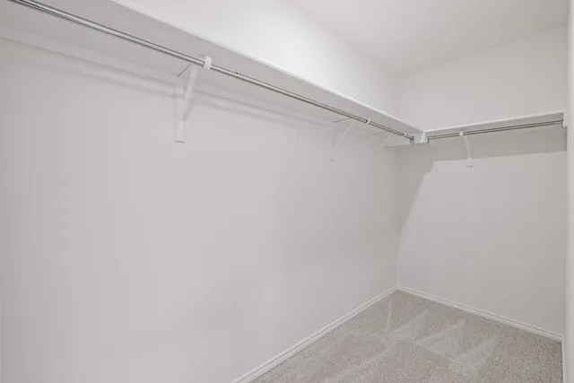 a view of a room with shelf on the wall