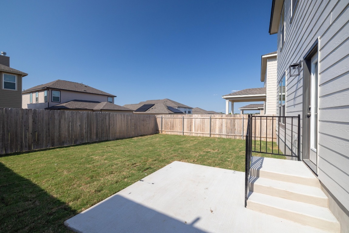 161 Lucky Texan Road Jarrell, TX 76537 - Photo 26 of 32 a view of a backyard with wooden fence