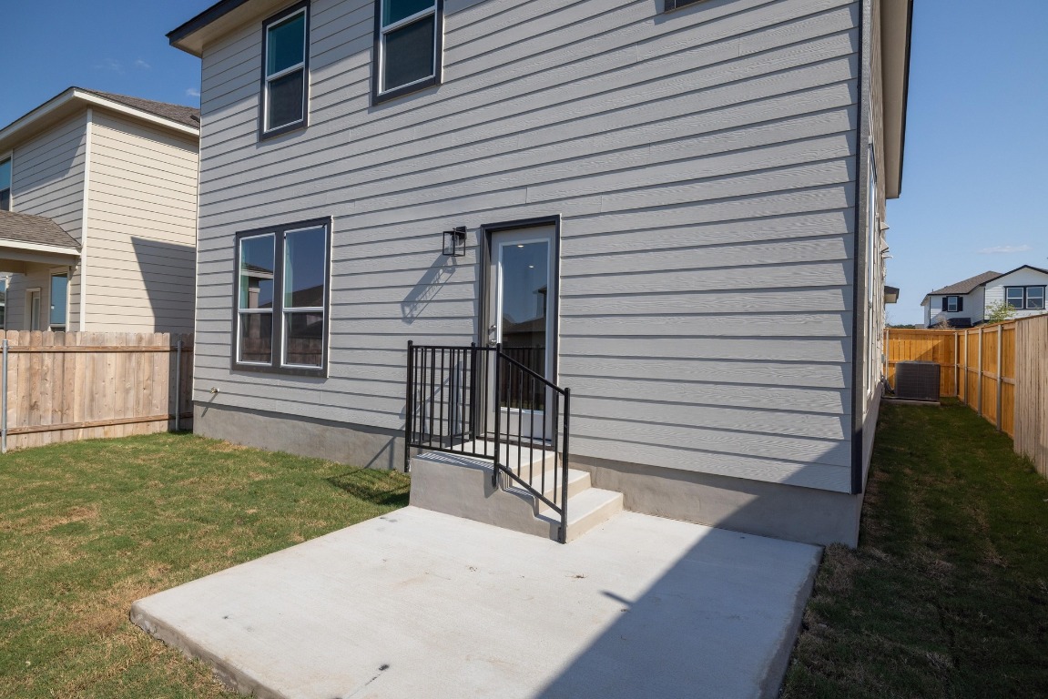 161 Lucky Texan Road Jarrell, TX 76537 - Photo 27 of 32 a view of a backyard with a garden