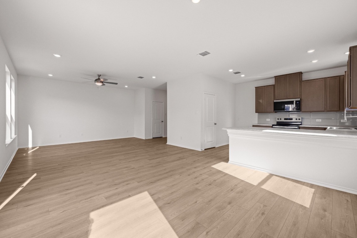 161 Lucky Texan Road Jarrell, TX 76537 - Photo 6 of 32 a view of kitchen with microwave and cabinets