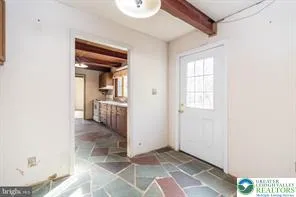 a kitchen with a refrigerator and a sink