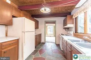 a view of a kitchen with a sink and a dishwasher